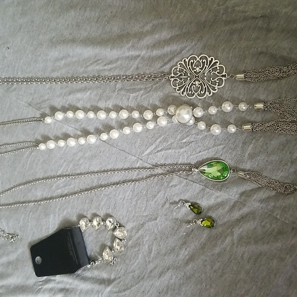 3 necklaces 1 earring and 1 bracelet
